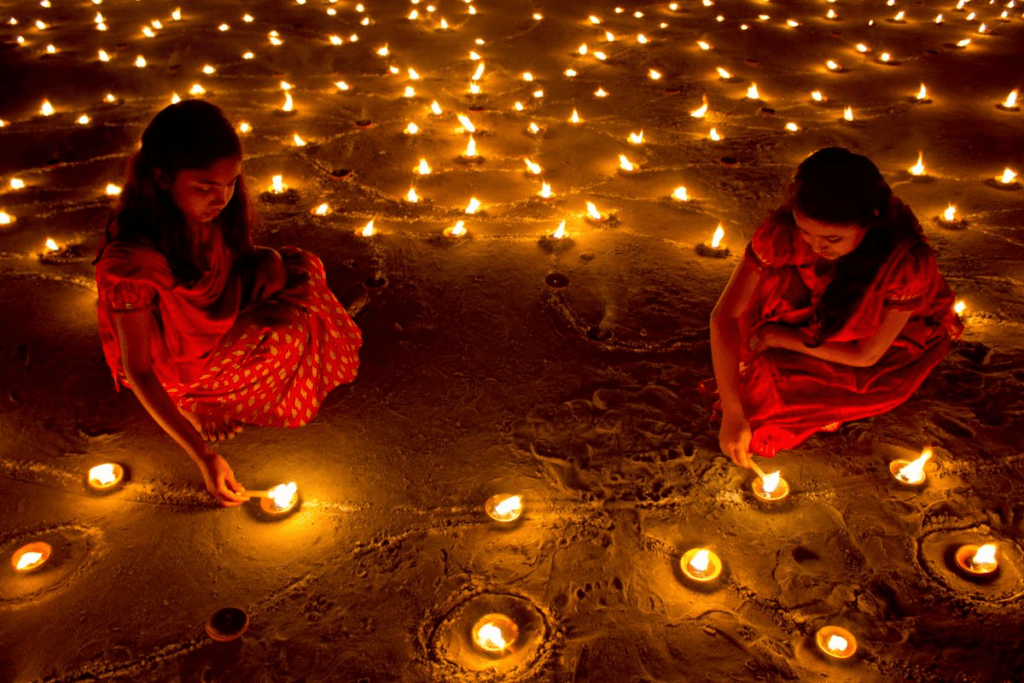 Children lighting diyas during Diwali, symbolizing continuity of tradition across generations